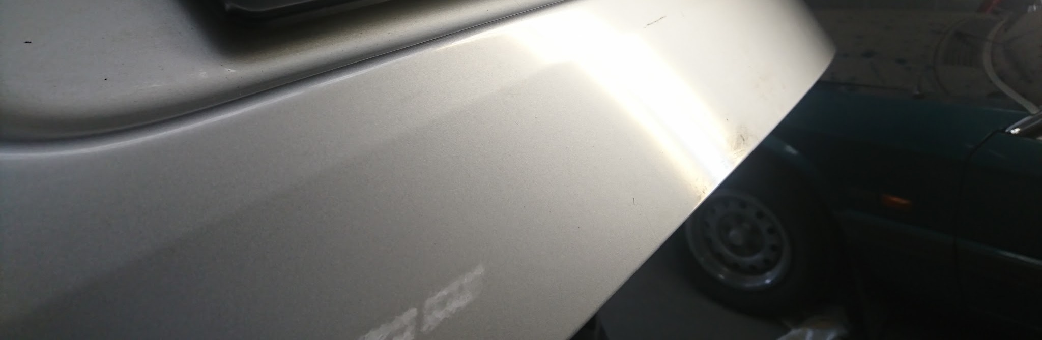 Silver boot lid on the bench inside the Delacombe workshop